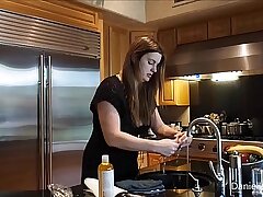 Carrots stuff the hot pussy of a big titty babe in the kitchen