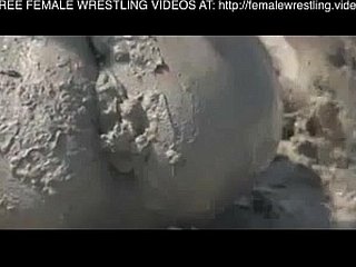 Girls wrestling near the mud